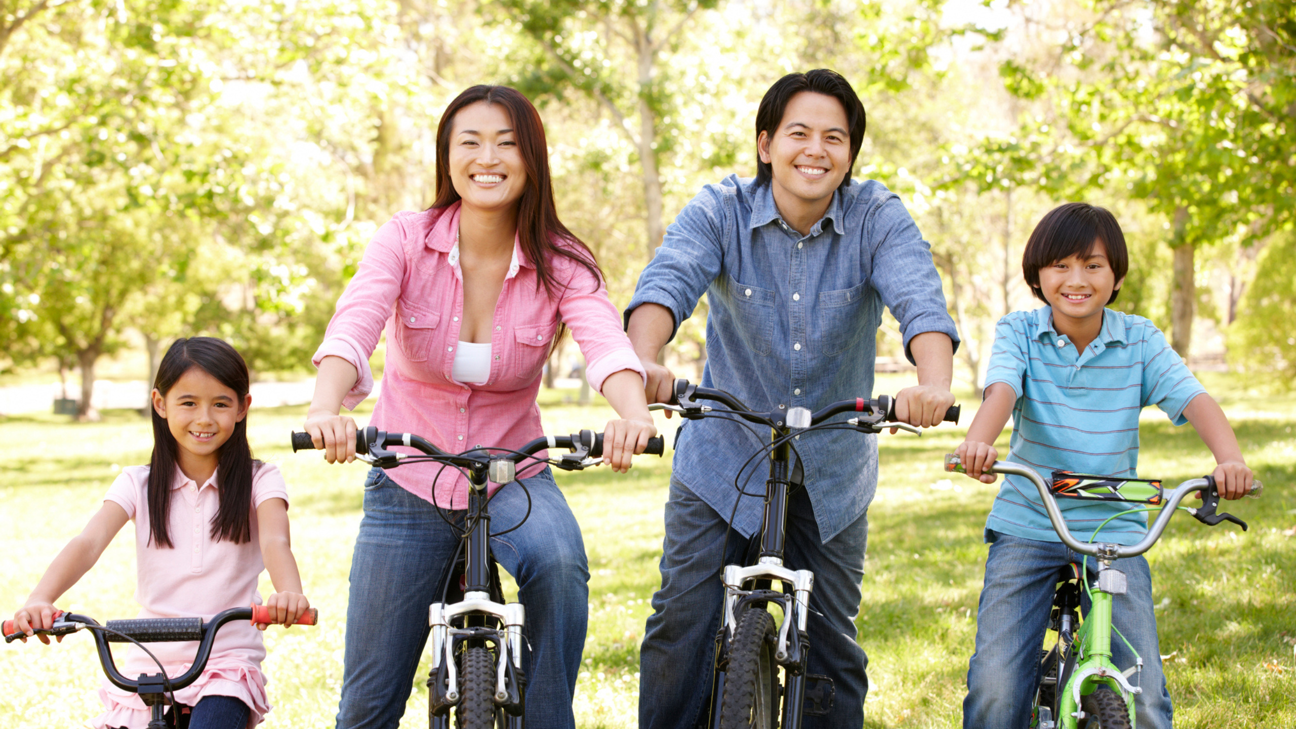 a happy family biking together