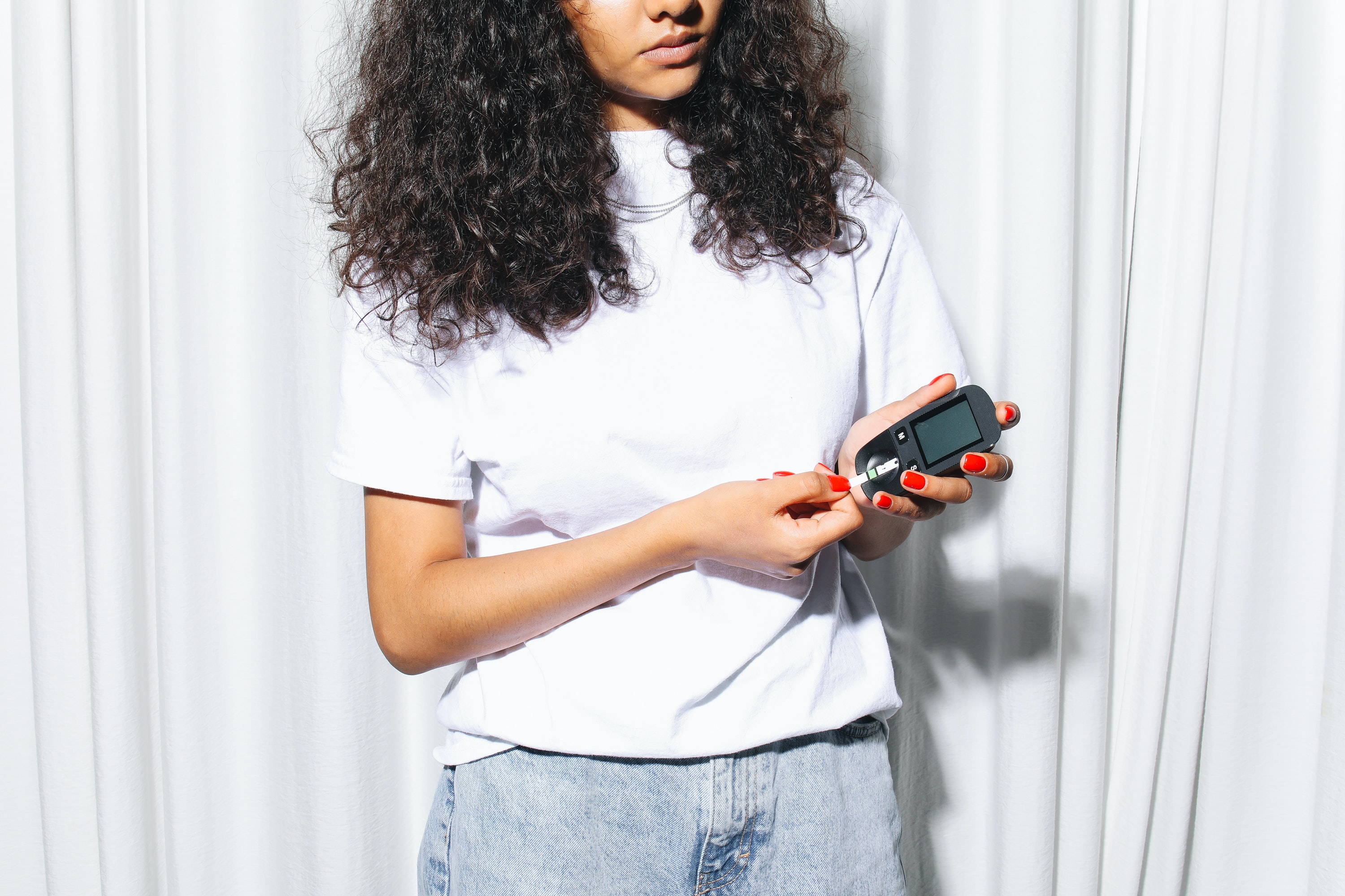 woman testing her blood sugar