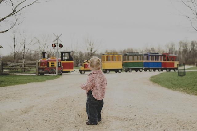 Photography Tips for the Camera Challenged: child looking at colourful train passing