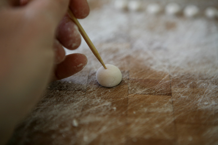 use skewer to poke hole in beads