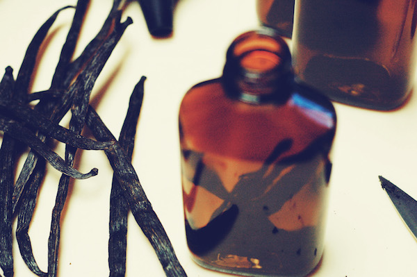 vanilla beans and an amber glass bottle