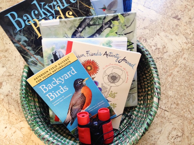 Gather some bird books into a handy basket