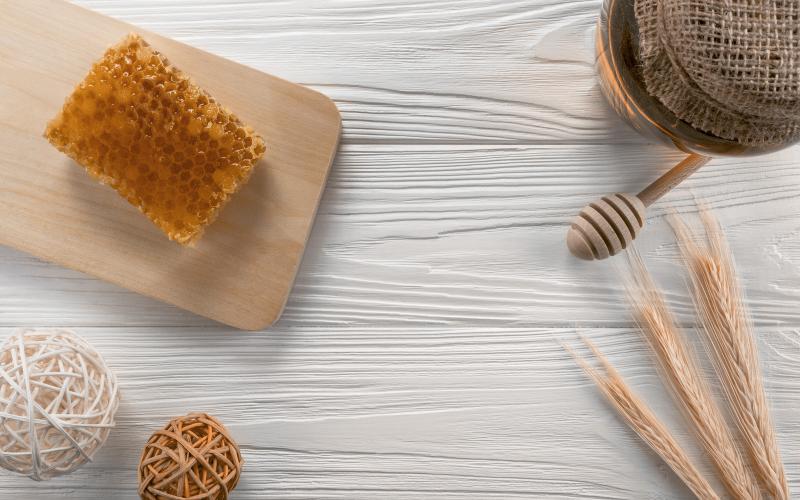 a honeycomb on a white wooden background
