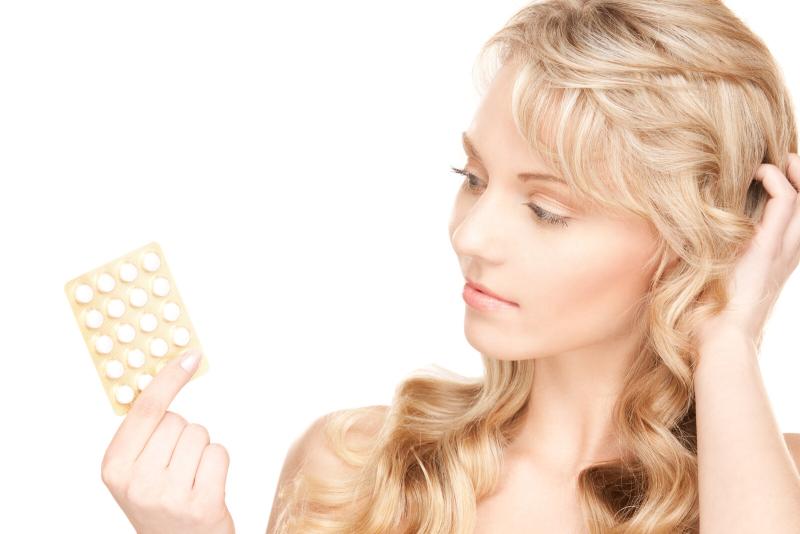 woman looking puzzled about birth control pills