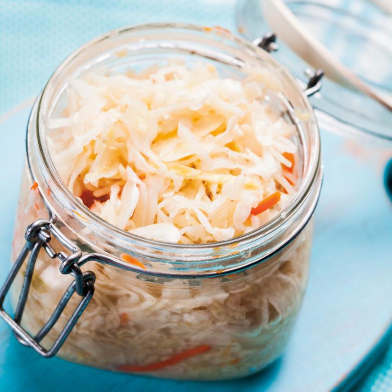 sauerkraut in glass jar on a table