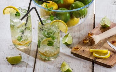 glasses of water with lemon and limes