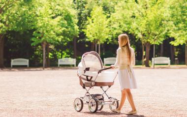 Postpartum Depression: Woman pushing stroller in park