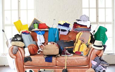 couch piled high with stuff
