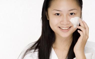 Ingredients in Skincare for Teens to Avoid: teen girl applying face cream