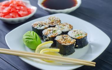 Spring Harvest Vegetable Sushi Rolls: sushi rolls on a white plate with chopsticks and wasabi