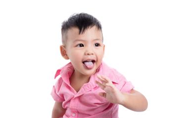 little boy with thrush on his tongue