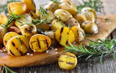 grilled potatoes with rosemary sprigs