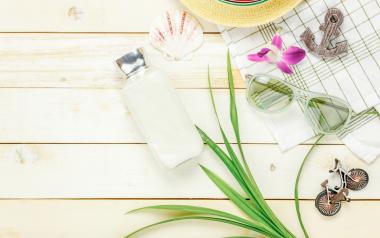 assorted summer items on a white wooden background