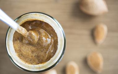 a jar of almond butter viewed from above