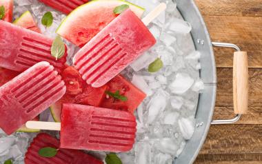 watermelon popsicles in a bucket of ice
