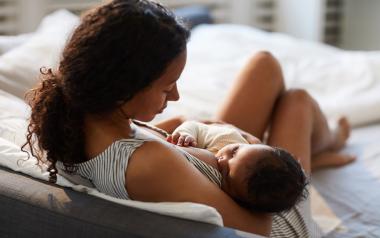 mother breastfeeding infant lactation consultant