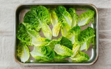 Leaves of lettuce being prepped for a dish