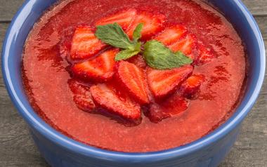 Carob Almond Pudding in a bowl with strawberry topping 