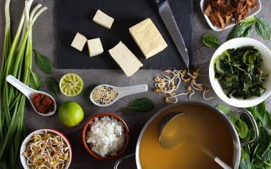 Miso soup ingredients laid out on a table for preparation