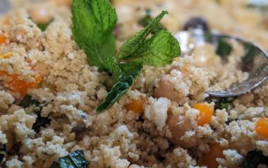 A close-up of a Mediterranean-inspired couscous salad