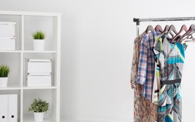 Sustainable Fashion designers: Room with cabinet and clothes on rack