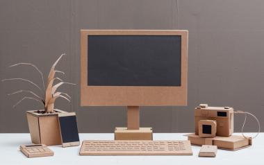 10 Ways to Go Green at Your Office: cardboard computer monitor, keyboard and office supplies
