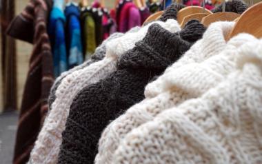 Wet Cleaning: Wool sweaters hanging on rack