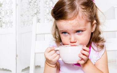 small girl drinking tea