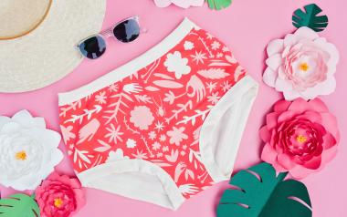 pair of underwear with white floral print on red background