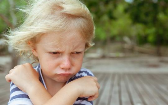 blond child pouting