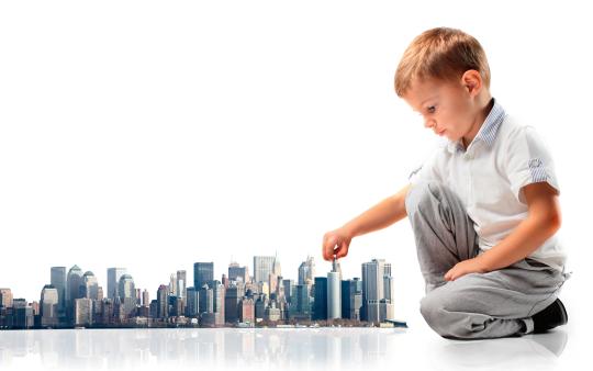 young boy playing with tiny city