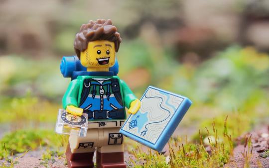 lego figure wearing orienteering gear