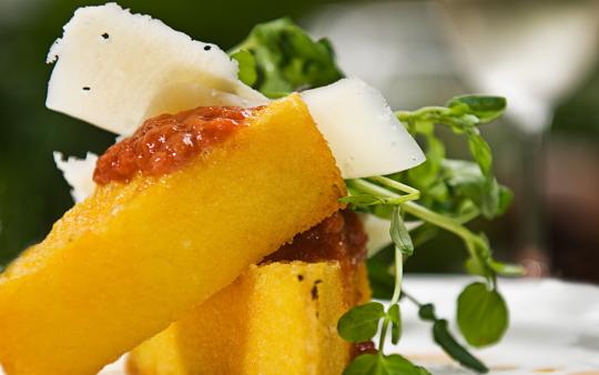 polenta with a tomato sauce, cheese and watercress