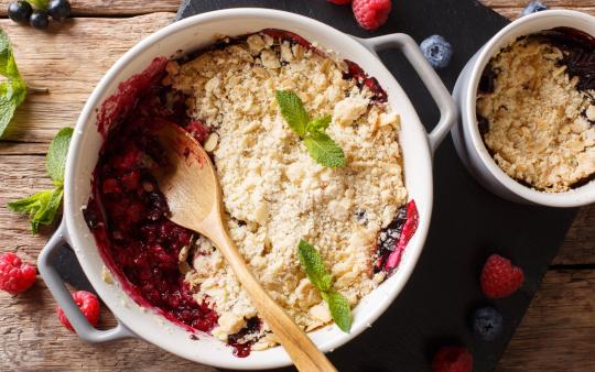 berry crumble being prepared in a casserole dish