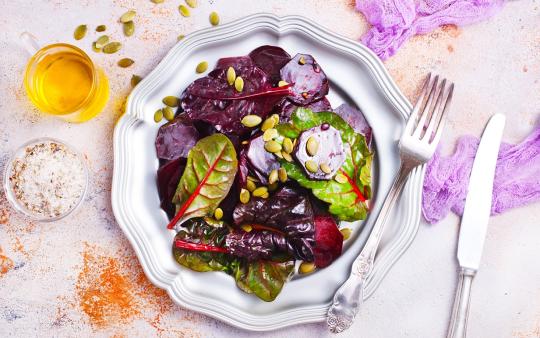 beet salad with nuts on metal plate