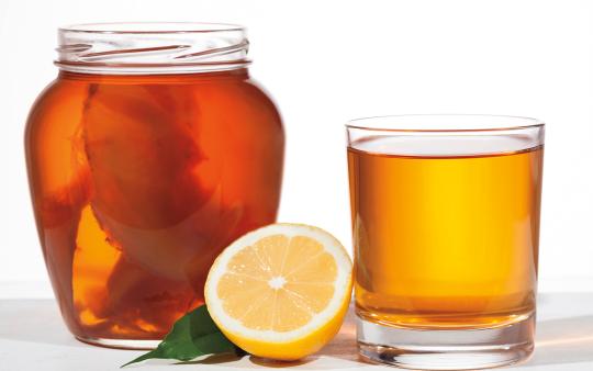 jar and glass of kombucha