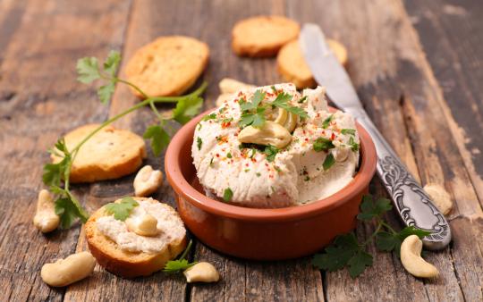 bowl of homemade vegan cheese with cashews