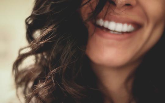 Smiling woman with healthy skin 