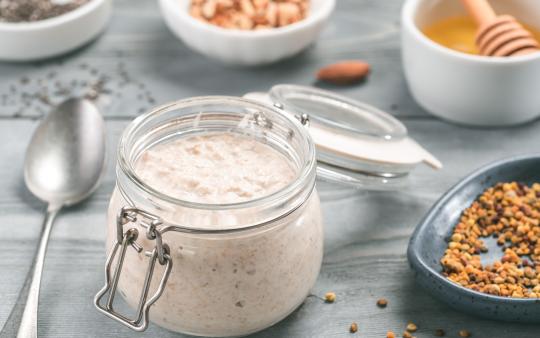 A mason jar full of creamy overnight oats.