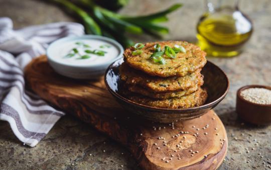 Amaranth pumpkin seed cakes stacked in a bowl