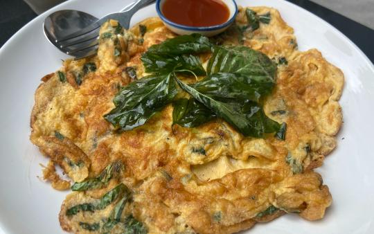 scrambled eggs with green veggies