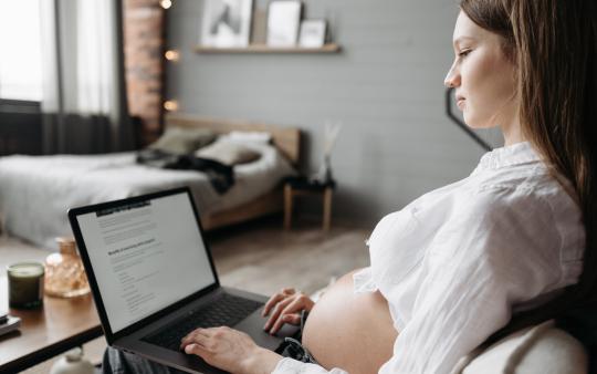 pregnant woman on laptop