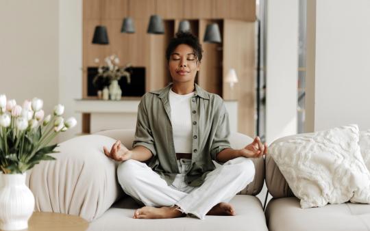 a woman sits in peace