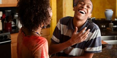 young black man laughing with his mother