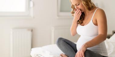 Home Remedies: Pregnant woman sitting on bed