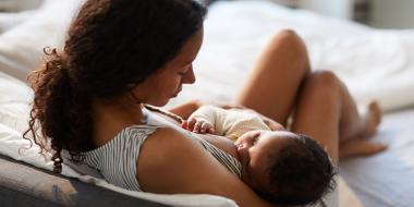 mother breastfeeding infant lactation consultant