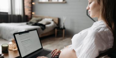 pregnant woman on laptop